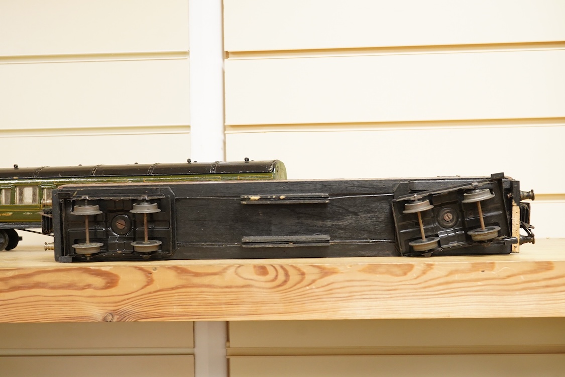 Four 0 gauge 1930s wooden Bonds bogie coaches; three Southern Railway; a Composite Brake, and two First Third Composites, and an LMS First Third Composite